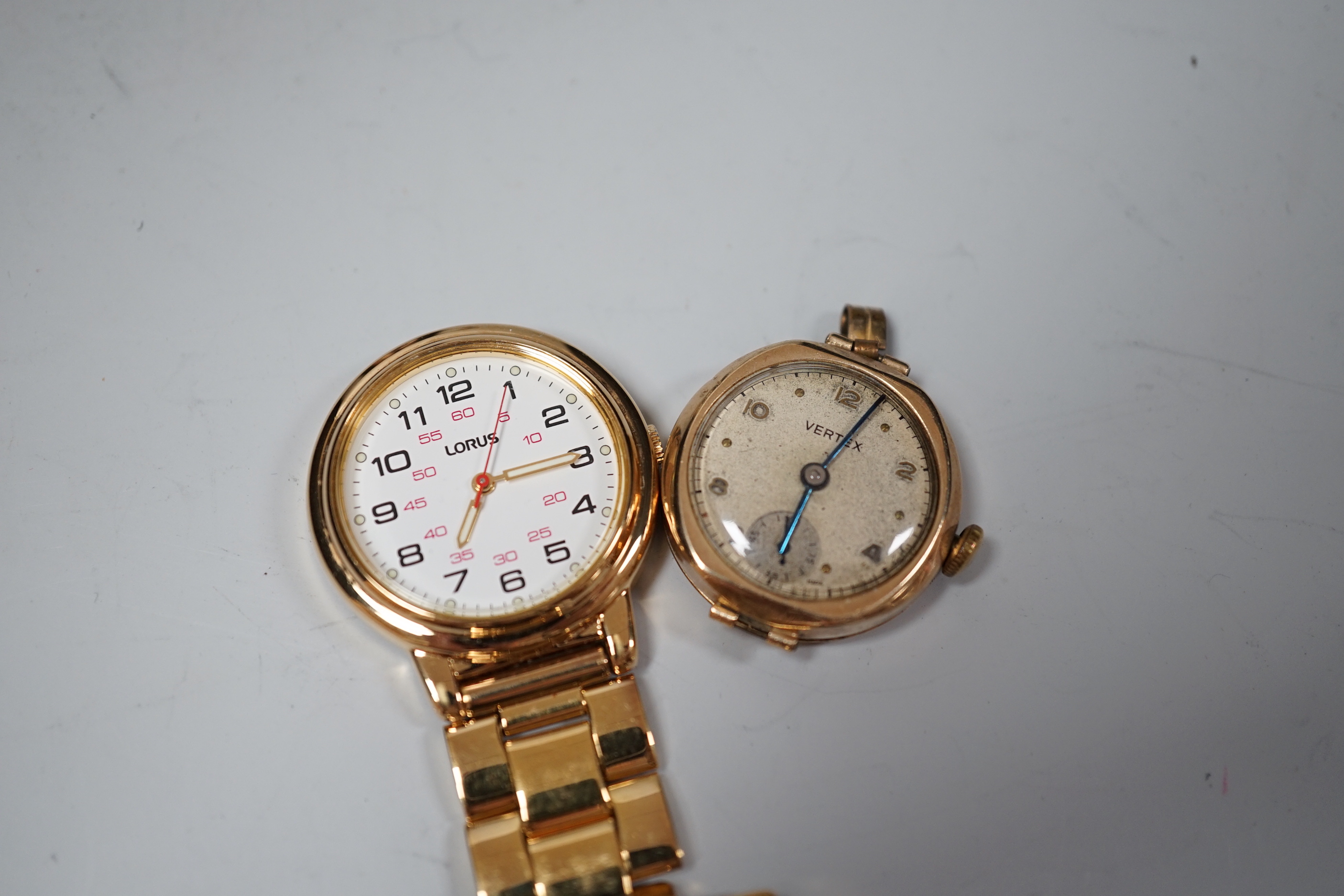 A George V silver christening mug, with dog handle, Sanders & Mackenzie, Birmingham, 1931, 77mm, together with a lady's 9ct gold Vertex manual wind wrist watch, no strap and a Lorus nurses watch.